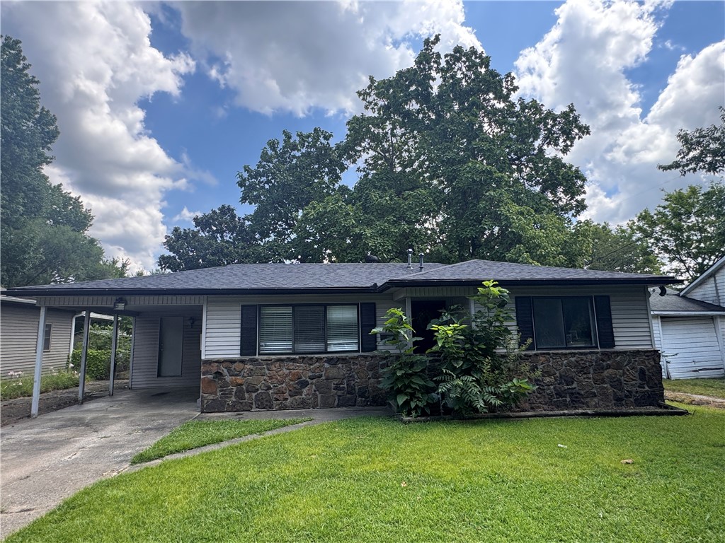 Welcome to your new home just minutes from the University of Arkansas, Dickson Street entertainment and Downtown Fayetteville. This 2 bedroom, 1 bath has a comfortable layout with a bright living area open to a kitchen with ample cabinet space Enjoy the large shaded backyard with a covered patio for entertaining. This home is located in a highly desirable area with easy access to the Razorback Greenway, shopping, and restaurants.