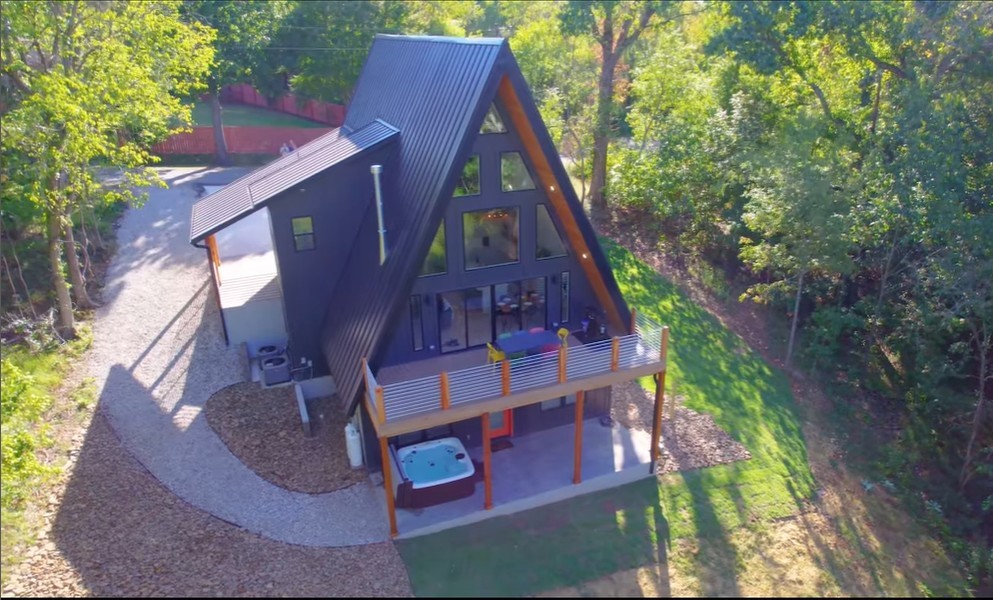 Located just 500 feet from the Down Under Loop hiking and biking trail, this home is a dream for outdoor enthusiasts. Enjoy Bella Vistaās stunning natural beauty with five lakes, 100+ miles of trails, waterfalls, and rock bluffs. Bike to the OZ Trails Bike Park, opening spring 2026, featuring a chair lift and 20 miles of downhill trails. Two full-length decks overlook a serene wooded backyard, with the lower deck fully covered and boasting a 1-year-old hot tub. The great room stuns with soaring 23-foot windows, flooding the space with light. The main-level primary suite offers a spa-like bath with a freestanding tub, spacious shower, and custom white oak vanities with quartz counters. A loft leads to a second bedroom suite with a walk-in closet, while the lower level includes a third bedroom, family room, and extra storage. Every detail of this exceptional home reflects quality and care!