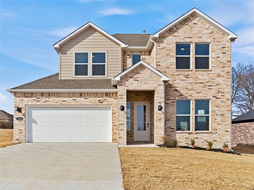 The Aurora plan in Noah’s Landing in Springdale, AR! These homes create a welcoming and comforting environment with open floorplans, an electric fireplace with a poplar mantle in the living room, and LVP throughout the first floor, carpet in upstairs bedrooms and living areas. In the kitchen, you will find a gas range, quartz countertops, and 42’’ cabinets! The primary ensuite features quartz countertops, tile flooring, a walk-in shower with tile walls, and a freestanding tub! The primary bedroom and ensuite are found downstairs with a secondary bedroom. Upstairs, you’ll find a game room and two bedrooms.  Each bedroom and the living room will have a ceiling fan. These homes will feature 4-sides brick with Hardie® siding (per plan), and a covered back patio (per plan) and a landscape package. You will enjoy the programmable thermostat that allows you to control your environment with the touch of a button! Taxes and parcel TBD. Taxes and HOA dues are approximate.