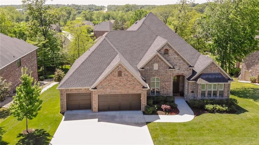 Stunning home with all the rooms you could possibly need. Beautiful/Modern design. This home definetly has the WOW.... Lots of windows and daylight. Family Room, Formal Dining, Office, Utility, 1/2 Bath 2 Bedrooms all on the main level. Plantation Shutters, Hardwood floors. Basement has 2nd living space, Media Room, Work out Room, Safe Room, and Storage Galore.This home has a full walk out daylight basement.   To add more icing to this stunning home it convey's with a Golf Membership. You don't want to miss this one.