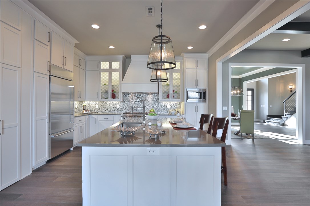 Breathtaking clean line contemporary custom build in Pinnacle subdivision. This sophisticated residence features a brilliant interior design executed by our in house designer. This home also includes an exterior living area and a storm shelter in the garage. Close to shopping, dining and more!