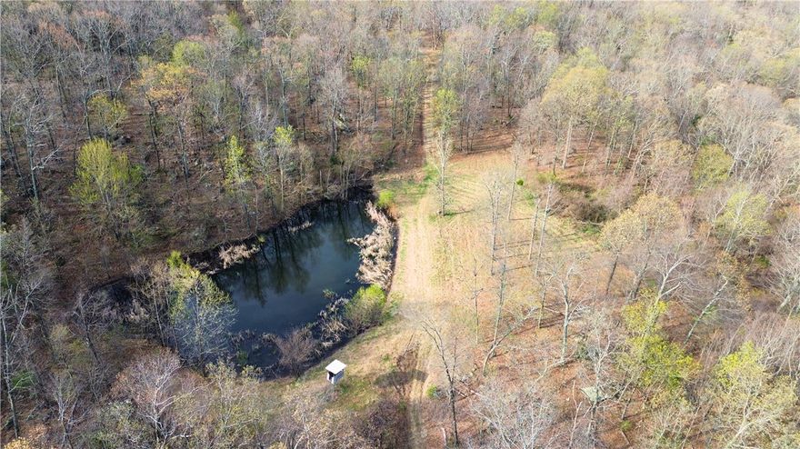 Secluded 320 acres with creek that is set up for hunting! Just a few miles off the highway down a dead end road, you get ultimate privacy with easy access. With a well maintained trail system, two ponds and multiple plots for wildlife, this one is ready to go. Long Creek meanders its way right through the middle of this unique tract and a natural gas pipeline creates a lengthy clearing for hunting and trail riding. Just through the gate are multiple cleared, flat areas for building a cabin or shop. Gorgeous views up top for miles with numerous rock features and bluffs. Healthy populations of deer, bear and turkey. If you're looking for privacy and a highly usable recreational piece, you'll want to check this one out. 20 minutes to Harrison, 30 minutes to Huntsville and 1 hour to Fayetteville. Buyer to verify, but should be able to connect to the natural gas line for service.