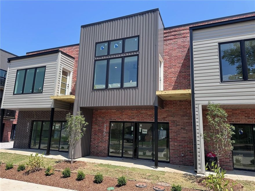 Modern Living in the Heart of Bentonville – Live steps from the new Walmart campus at SoMa Terrace—where world-class trails, restaurants, and vibrant public spaces are right outside your door. Cross the light at the end of 10th Street, and you're instantly on campus. Just two blocks away, explore the culinary scene at 8th Street Market, enjoy live outdoor music at The Momentary, or grab your favorite brew at one of the many local coffee shops within walking distance. This move-in-ready two-story townhome is designed for effortless living and modern comfort. The spacious primary suite includes a private morning porch, a huge tiled walk-in shower, a generous bath, and a walk-in closet that dreams are made of. Plus, enjoy the convenience of a full appliance package—including refrigerator, washer, and dryer—a $5,000 upgrade that’s already included. Window blinds are installed, so there’s nothing left to do but settle in. SoMa Terrace isn’t just a home. It’s a front-row seat to everything Bentonville has to offer.