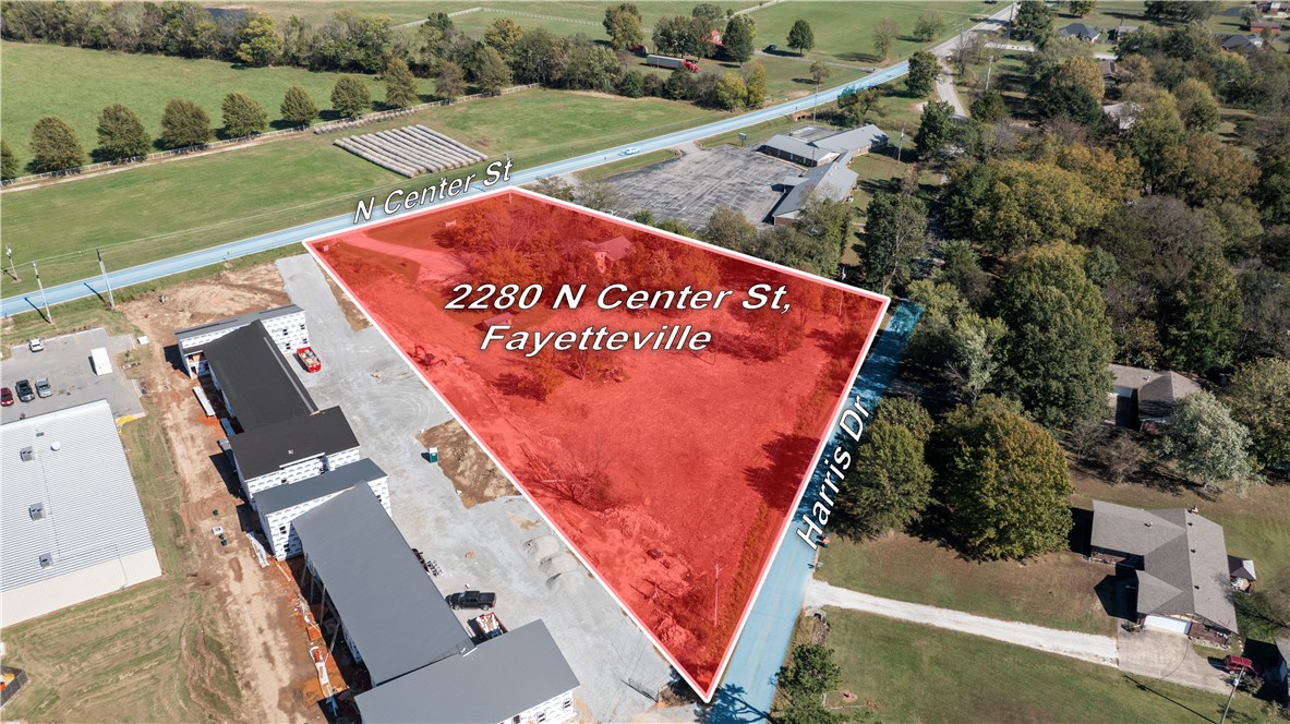 Excellent Development Opportunity! 2.5 flat acres with dual road frontage—160' on Hwy 16/N Center St
and 445' Frontage on Harris Dr-offering great visibility and access. Existing 3-bedroom, 2-bath structure currently operates as an office/Warehouse R&D. The property is ideal for commercial- QSR, Restaurant, strip mall, Office Space, or multi family development. Prime location in Elkins City limits near schools and businesses. Currently zoned residential. Endless potential for Investors or Builders.