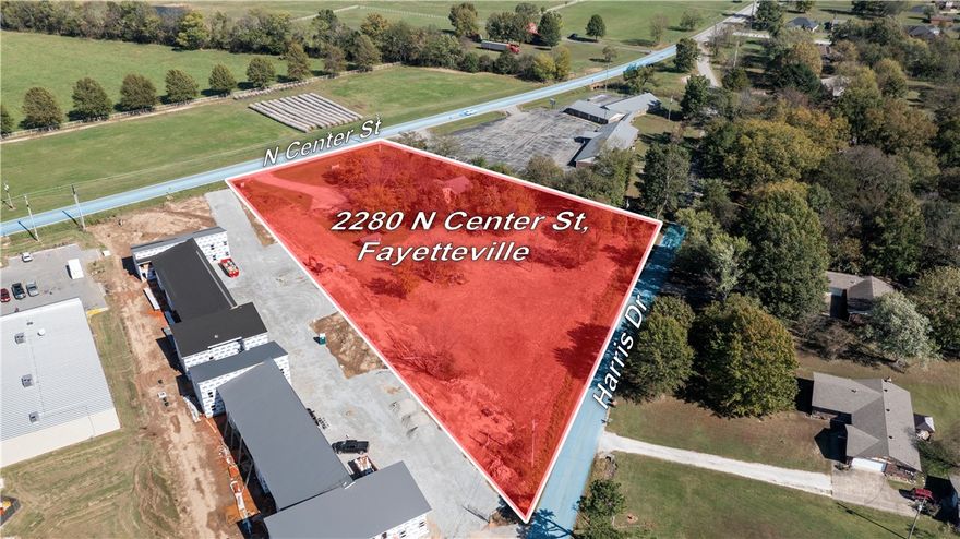 Excellent Development Opportunity! 2.5 flat acres with dual road frontage—160' on Hwy 16/N Center St
and 445' Frontage on Harris Dr-offering great visibility and access. Existing 3-bedroom, 2-bath structure currently operates as an office/Warehouse R&D.  The property is ideal for commercial- QSR, Restaurant, strip mall, Office Space, or multi family development.  Prime location in Elkins City limits near schools and businesses.  Currently zoned residential.  Endless potential for Investors or Builders.