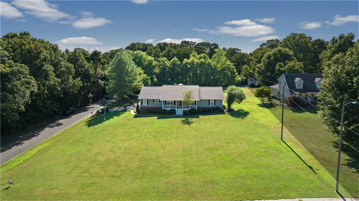 Have you been dreaming of a country estate, but hate to be miles and miles from town? This property checks all your boxes! With two living areas, you can entertain all the friends and family, and the kiddos will have their own space to hang out. The party can spill out onto the large deck and into your 1.08 acre yard as well. Cook up a storm in your beautifully appointed kitchen, and enjoy serving it all up in your huge dining room. Everyone will love their large bedrooms with plush new carpet, and you'll adore the easy-to-maintain new luxury vinyl plank flooring, too. The new LED lighting throughout your home gives it that bright and cheerful modern touch. Sip your morning coffee on the expansive covered porches and enjoy the view of your gorgeous estate. All of this is just seconds away from amazing trails, John Brown University, downtown Siloam Springs and lots of shopping and restaurants. Schedule your personal tour today and start packing!