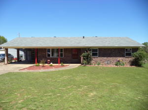 Beautiful country home close to town! Lots of new updates to be found in this nice brick home looking for its new family! Big 5 acre lot includes big fenced yard, 3 acre m/l pasture with a pond in back, shop/garage with power on a slab. Large family room with open kitchen and island. Too many nice touches to name, see this one before it's gone.