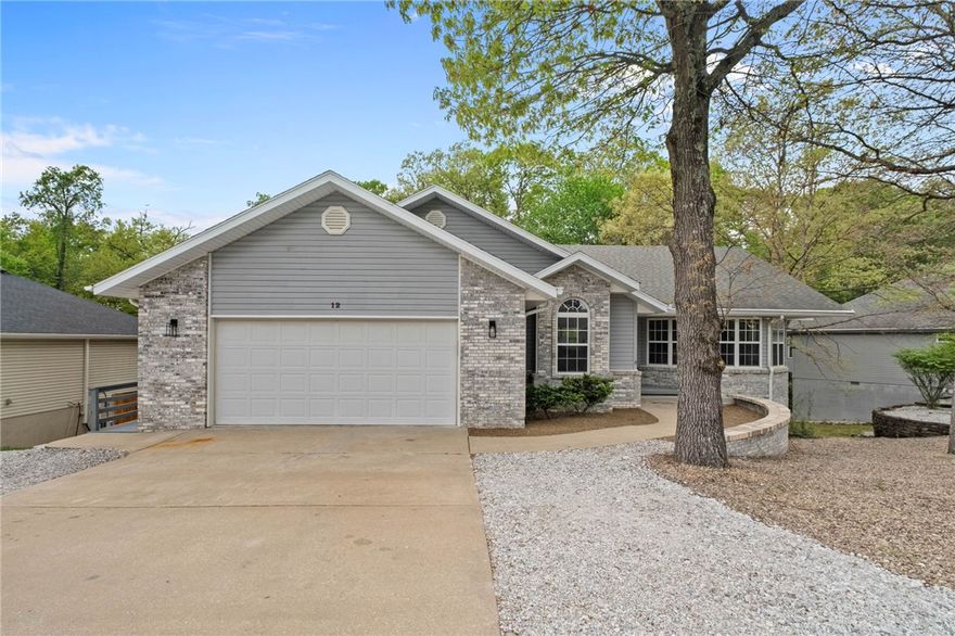 Come home to this completely remodeled home in beautiful Bella Vista. Featuring an open floor plan, hardwood floors throughout, all new lighting and hardware, granite countertops, new SS appliances including refrigerator, all new custom cabinets and so much more. Located just blocks from Lake Ann and Lake Rayburn with bike trails just around the corner. The home also features a massive 716 square foot basement workshop.