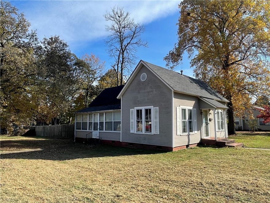 ABSOLUTELY ADORABLE AND CHARMING--evokes warmth, nostalgia, and a timeless sense of characteristics from yesteryear! So much personality-- and offers the cutest floor plan. Entering the front door, you have a living room and a dining room. Next is a country style kitchen with loads of cabinets. This classic hallmark of homes offers a remodeled bath w/ brand new flooring. New roof on a portion of the home. Sunroom/exercise room, home office --a versatile bonus room. Built ins everywhere! Large fenced yard for kids and canines!  Close to the university!  **May have hardwood floors under the carpet in the living room and dining room.