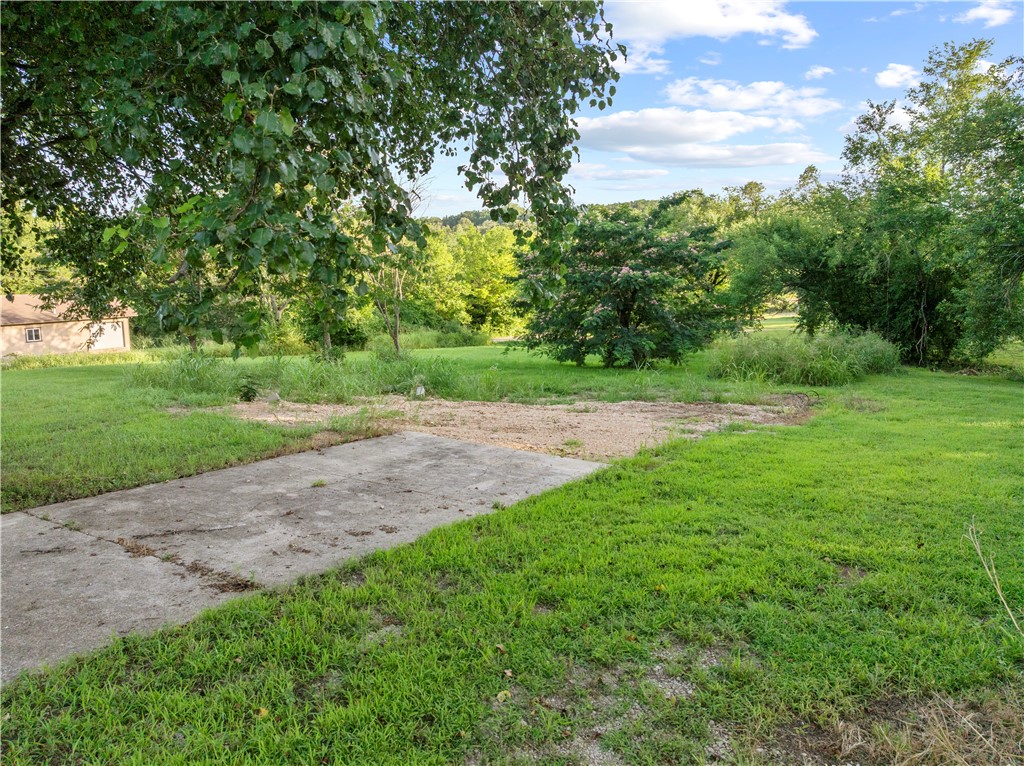 Enjoy the charm of small-town living just 20 minutes from Harrison, AR and 35 minutes from Branson, MO! This 0.81-acre corner lot sits in a peaceful neighborhood near Bull Shoals Lake and offers multiple utility options. An existing well is on site, and public water and sewer are available at the road—buyer to verify the status and availability of all utilities. Whether you're planning a forever home or a weekend getaway, this property combines a laid-back lifestyle with quick access to lake fun and city amenities.