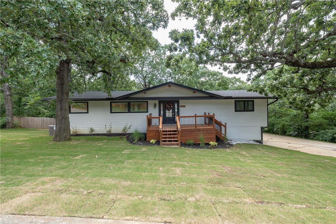 Completely remodeled in 2020 and just 1 mile from the University of Arkansas, Razorback Stadium, and Dickson Street, this spacious 4-bedroom, 3.5-bath home offers over 3,400 sqft of modern living in a prime Fayetteville location. Every major system has been upgraded, including a new roof, siding, windows, two HVAC units, hot water heater, plumbing, electrical, and added insulation. Inside, youāll find fresh paint, new carpet and vinyl flooring downstairs, and a bright, open layout with cathedral ceilings. The kitchen features a large island with bar seating, granite countertops, stainless appliances, and a built-in wine fridge. The primary suite includes a walk-in closet, jetted tub, and a huge walk-in shower. Outside, enjoy fresh landscaping, new sod, a freshly stained front patio, and a newly stained deck that runs the full width of the home. A nearby trail at the end of the street connects directly to campus, adding even more convenience to this beautifully updated home.