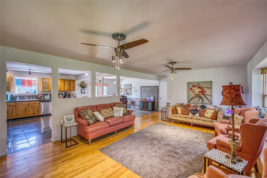 This is a custom home on apx 1.5 acres with 6-7 bedrooms and approx. 3500 sq ft. This dream destination is perfect for a large family. The main level: living room, kitchen, dining, 3 bedrooms & 2 baths have hardwood and marble flooring, granite, stainless steel appliances & whirlpool tub, and includes a wood stove. The lower level: living area, kitchen, dining, a full bath with custom lavender walk-in shower, plus 3-4 more bedrooms. All of the rooms downstairs have ceramic tile flooring plus cedar and pine walls. Enjoy a large deck on the upper level and huge covered patio on lower level. All of the furnishings can be included if buyer wants them! It doesn't get more move in ready then this!