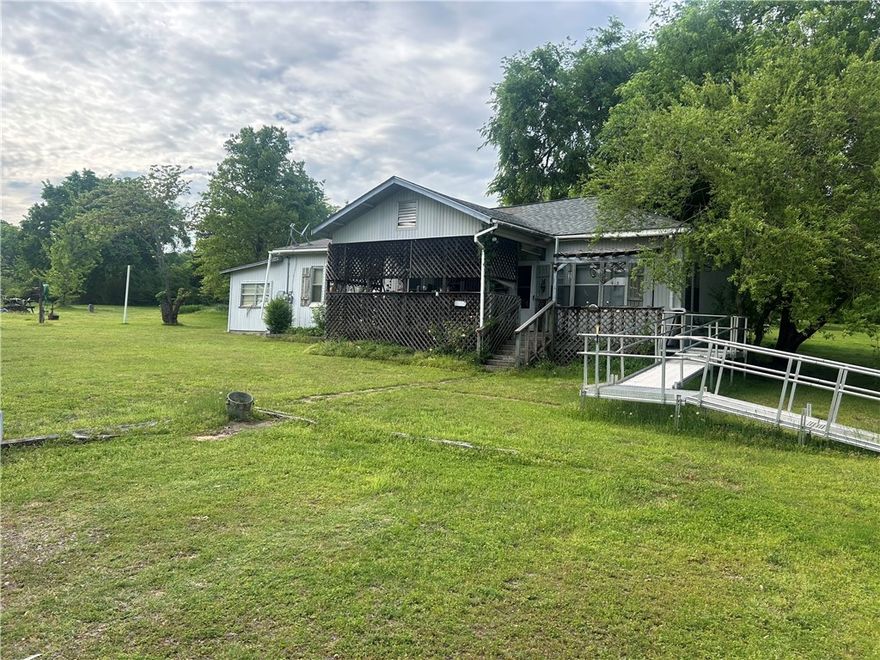 Older home with rural setting.  Home is vinyl siding, 3 bedroom, 1 bath, c/h/a, 3 storage buildings, 10 yr old roof.  Also there is a 19' x 37' slab for carport or shop.
