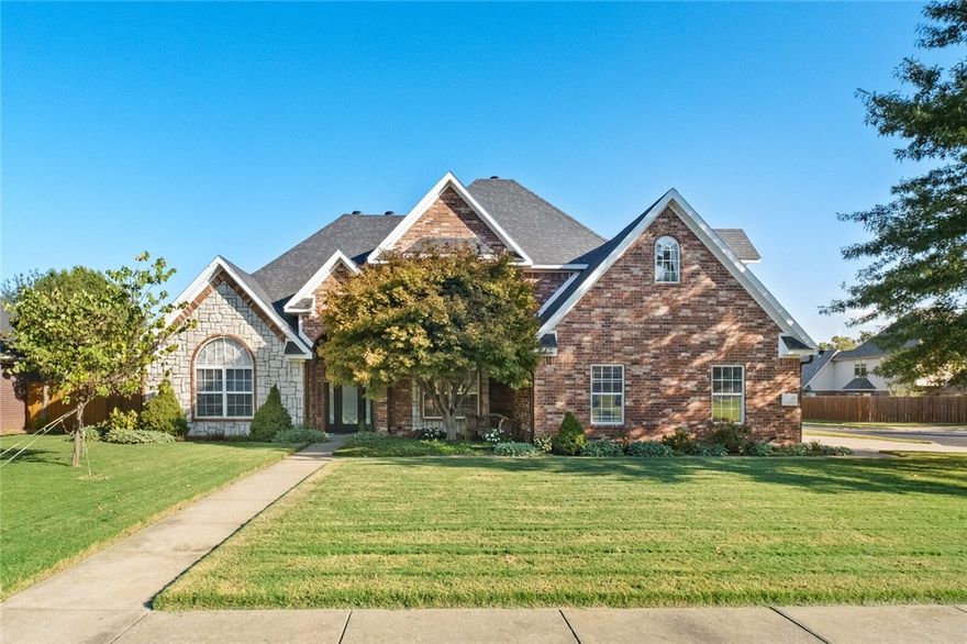 Location, floorplan and serene beauty! This home has it all! Walk to elementary or middle school, hop on the bike paths or Coler in minutes. Easy access to DT Bentonville and all things NW Arkansas. This corner lot home exudes charm from the landscaped front yard with sitting bench to the peaceful back yard with covered no maintenance deck, leisure pool and hot tub. The home has a fantastic floorplan with open living space, soaring ceilings, oversized bedrooms, closets you could live in and a bonus off one bedroom that can make a double spare bedroom, exercise, office, media or playroom. Don't miss the reading hideaway off the bonus or the under-stair closet. Find safety in your underground shelter. Peace of mind upgrades include roof (2022) water heater (2020) pool pump (2025) and a well-maintained home that allow you to have full enjoyment. Wood floors, a stained fence,3 car garage, refrigerator and a storage building are a few of the additional bonus items that makes this home a must. Make 3100 NW Alberta home!