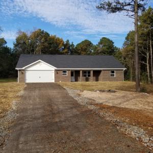 ORGEOUS BRAND NEW HOME. If you want a fresh, worry-free and beautiful home, this is exactly what you are looking for! Quality construction, contemporary style and a peaceful location on a big lot in a nice rural neighborhood. A split floorplan is perfect for the family and the master bedroom offers a big master bath, walk-in closet plus a second closet. The granite countertops, custom-made cabinets and center island with oven really make this kitchen stand out above the rest. The large 2 car attached garage has plenty of room, and you have two covered porches for enjoying morning coffee and evening barbeques. Just picture comfortable country living in this perfect home... don't wait, come see it for yourself!