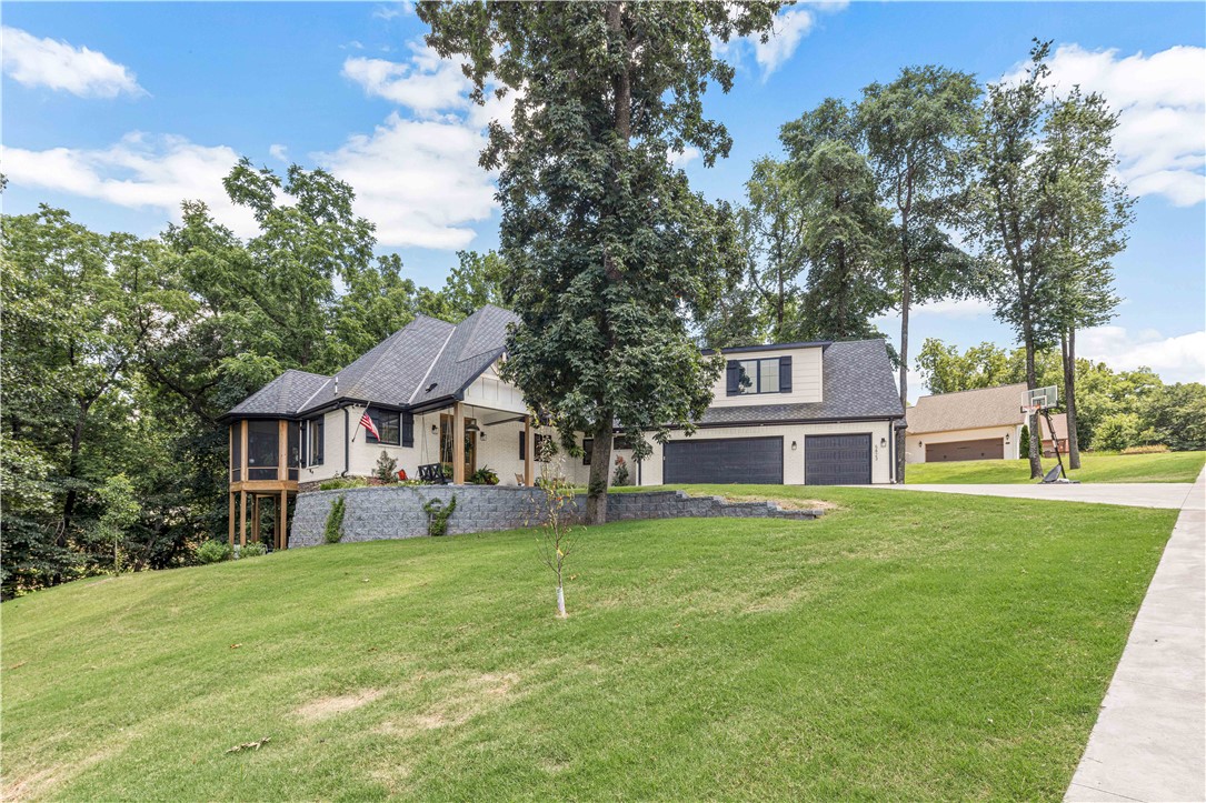 Like new fully custom 3 level home on .75 secluded acres in very desirable West Fayetteville. Main level includes Large Master Bedroom with Ensuite and large walk in closets, with kitchen and living room and half bath. The entrance to the wrap around deck and screened in porch area with TV is off of the LR. The Upstairs level has large office, 2 bedrooms and 1 full bath. Downstairs full basement includes large game / tv room with built in wet bar, two bedrooms, 1.5 BA, large storage / work out room, and entrance to mechanical room / crawl space. The walkout covered porch wraps around to a covered hot tub area with outdoor tv. Secluded tree lined sloping lot in very private neighborhood. Agent Owned.