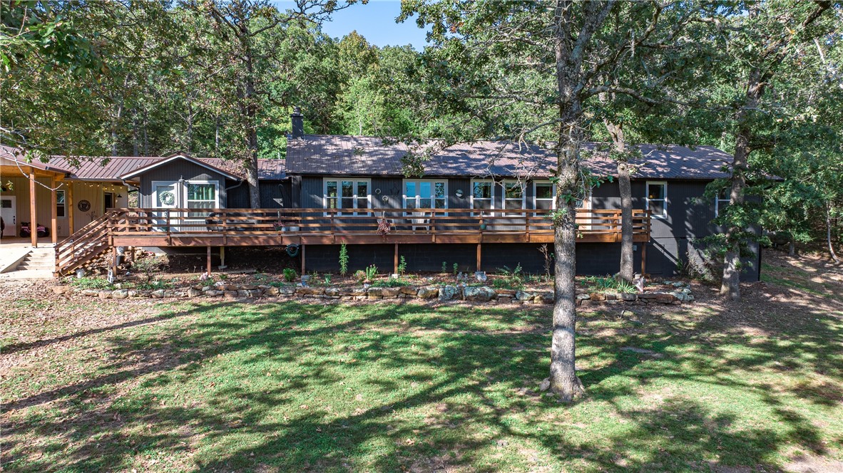 Peaceful easy living at this 4 bedroom and 3 bathroom ranch type home nestled on 5 acres at the edge of town. Feels so private and you can relax on the front deck or enjoy the huge covered patio. Spacious open living area with split bedrooms, large 3 car carport with attached shop, and small pole barn. Make your appointment to fall in love with your new home! Approved borrowers will receive a closing cost credit of 1% of the loan amount up to $5,000 on their Closing Disclosure on their loan closing with Envoy Mortgage Branch NMLS #2659248 and Branch NMLS #2579798.