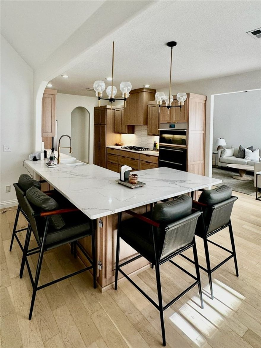 Experience modern luxury living in Shadow Valley, a fully renovated 4-bedroom, 3-bathroom home featuring a spacious bonus room in the heart of Rogers’ premier gated community. The chef-inspired kitchen serves as the home's centerpiece, boasting Twin Oak custom cabinetry, premium Quartz countertops, and a high-end appliance suite including GE Café, Fisher & Paykel, and Bosch. Every inch of the interior has been refreshed with new hardwood flooring, plush carpet, custom window shades throughout, and new paint, while a central vac system adds everyday convenience. Extensive mechanical updates provide total peace of mind, including a new roof and water heater (2019), a 2017 HVAC, and a hot tub that was fully serviced in 2025 with a brand-new heater along with an irrigation system.  This sought-after community offers an 18-hole golf course, tennis and pickleball courts, a pool, and a fitness center. Residents also enjoy a private restaurant and lounge, alongside playgrounds, basketball courts, and scenic fishing lakes.