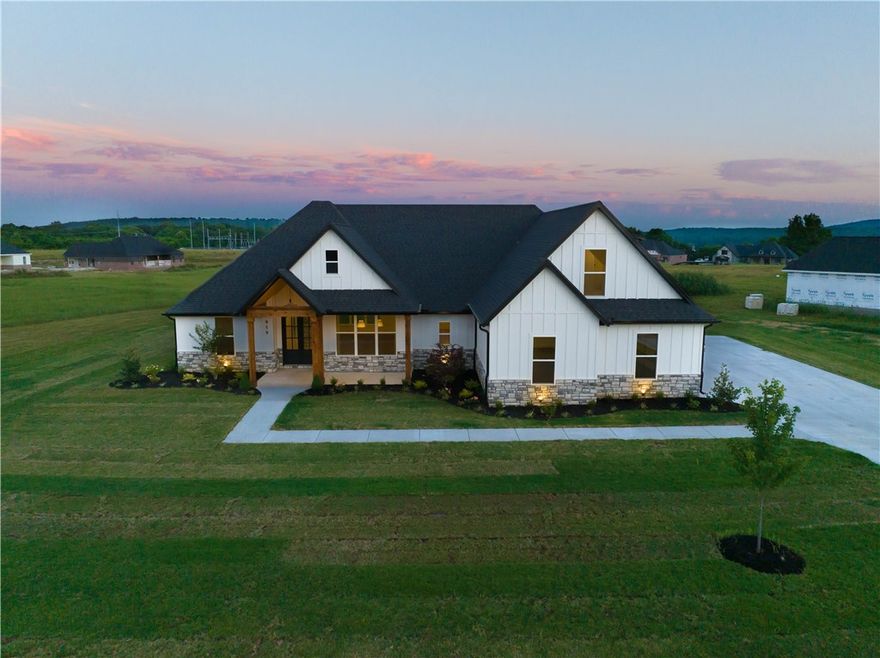 Introducing a stunning new construction home on an expansive acre lot boasting breathtaking mountain views and convenient access to the tranquil White River. This thoughtfully designed residence offers a seamless blend of modern luxury and timeless charm. Step inside to discover an open kitchen and living area, adorned with stylish LVP flooring, perfect for casual gatherings or formal entertaining in the adjacent dining room. The master suite provides a serene retreat with dual vanities, large walk in closet, walk-in shower and a soaking tub. Two additional bedrooms, a versatile upstairs bonus room, and a 3-car garage offer ample space for living and storage. Outside, a covered patio overlooks the sprawling yard, inviting you to savor the beauty of NWA living. Don't miss this opportunity to call this exceptional property home.