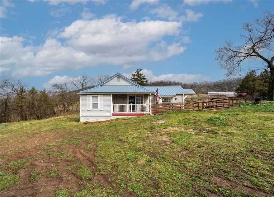 Charming 2 bed 1 bath with bonus room/office with handicap ramps on .67 acres highway frontage. New Hot water heater in september 2025,heat andd air replaced in 2019. Propane wall heater in dining room.Refrigerator,deep freezwe and washer and dryer can convey with acceptable offer.
Turkey houses behind are not active,