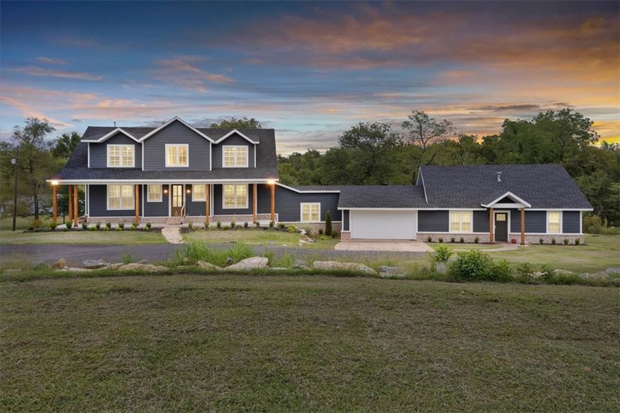 Nestled in the heart of West Bentonville, this exceptional 4.37-acre property seamlessly blends country living with urban convenience. Built in 2023, the home boasts a picturesque setting accessed via a private drive, surrounded by park-like landscapes that include a barn, raised organic garden beds, flourishing fruit trees (apple, pear, cherry, mulberry) and a chicken coop. The property extends to McKisic Creek, offering endless nature views. The main residence features vaulted ceilings & a welcoming drop space upon entry. The family, kitchen, & dining areas showcase a wood-burning fireplace, custom cabinets, granite countertops, & decorative beams. Upstairs, 3 additional bedrooms accompany a versatile space ideal for a game room or study. Adding to its allure, a 1,489 sq ft attached ADU (not included in the square footage) provides flexibility for guests or multi-generational living arrangements. The walkout basement boasts a full game room, gym, study, & hobby area. Enjoy convenient country living at its finest!