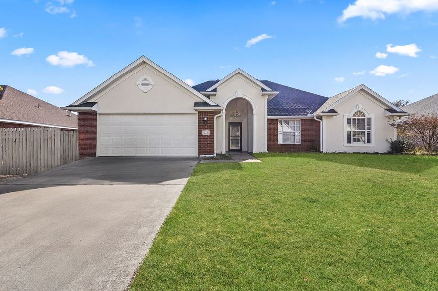 Beautiful home in the Deerfield Subdivision! Exceptional layout boasting a flowing floorplan centered around a spacious open living area and enhanced by a warm gas-log fireplace. Eat-in kitchen, featuring sleek stainless steel appliances, a convenient center island and luxurious granite countertops that extend throughout the house. Dedicated formal dining area provides in elegant space for special gatherings. Primary bedroom offers a touch of luxury, featuring tray ceilings, a dual sink vanity, jetted tub and separate shower. Split bedroom floorplan provides spacious bedrooms for everyone. Fully fenced for privacy and features a covered patio, perfect for al fresco dining or enjoying your morning coffee, rain or shine. Prime location that is close to schools, parks with convenient access to 71-B and I-49. Only 10 minutes away from Lake Fayetteville. Property is perfectly combines luxury amenities with practicality and a fantastic location, making it a must-see!