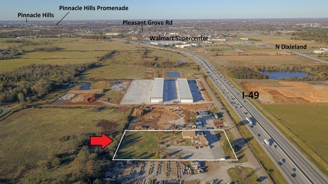 Prime commercial I-49 road frontage. Visible from I-49 with 100K+ daily traffic count. 2.56+ acres of endless opportunities. Property has 6600 SF structure on site. Property is in the heart of development. Just minutes from Pinnacle Hills Mall, Mercy hospital and JB Huntāāāāāāāāāāāāāāāāāāāāāāāāāāāāāāāā HQ.