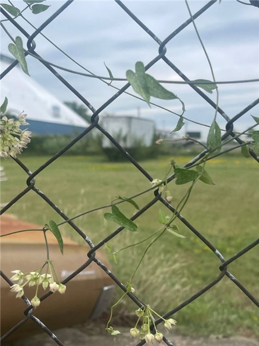 Ready for development. Level , cleared .64 acre lot in Port of Fort Smith area. Fully fenced and adjacent  to building at 1220 S. 6th St. May be purchased together  or separately MLS# 1330263