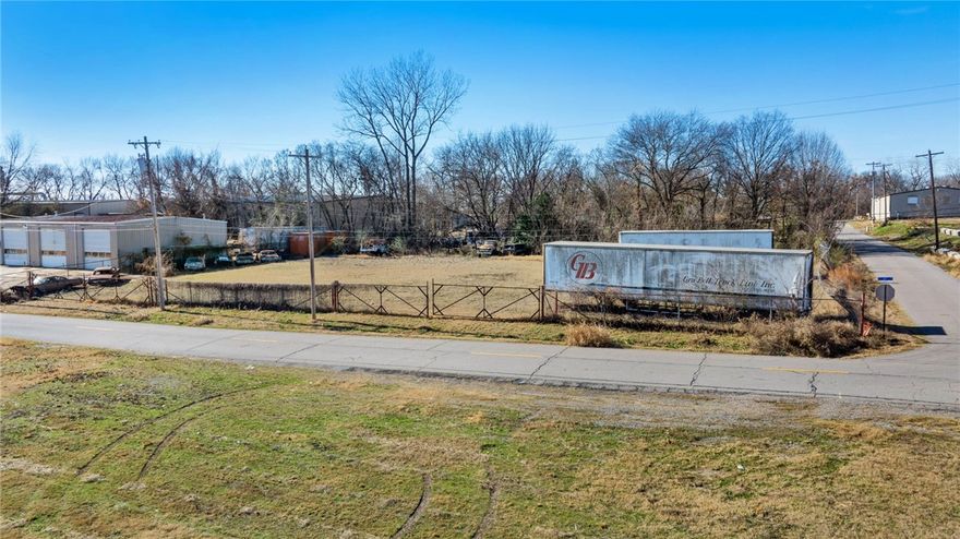 Ready for development. Level , cleared .64 acre lot in Port of Fort Smith area. Fully fenced and adjacent  to building at 1220 S. 6th St. May be purchased together  or separately MLS# 1330263