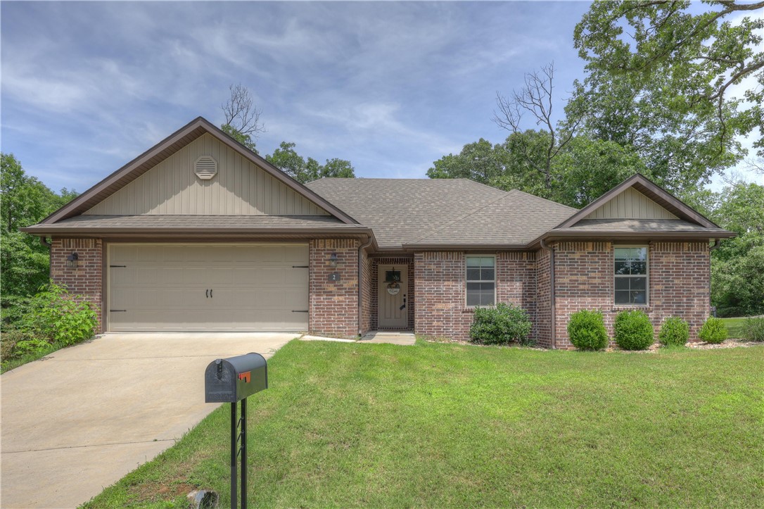 Whether you're a mountain biker, outdoor enthusiast, nature lover, or simply craving peace and privacy, this Bella Vista gem offers the ultimate in Ozark living. Built in 2020 and beautifully maintained, this home is ideally located just 0.2 miles from the renowned Back 40 Trail System. Enjoy an open floor plan featuring granite countertops, walk-in pantry, stylish and durable LVP flooring, and cozy fireplace. The thoughtfully designed split layout ensures privacy and comfort for everyone and the spacious primary suite is a true retreat complete with a jetted tub, walk-in shower, and an oversized walk-in closet.
Situated on a corner lot of a quiet neighborhood, this home is ideal for trail lovers and anyone looking for a well-crafted, peaceful home in a natural setting.