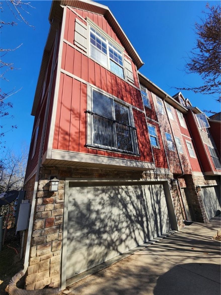 Fantastic condo off I49! Townhouse has 2 beds, 2.5 baths, 2 car garage with open concept layout. Kitchen and living area are complete with pantry, island, and all appliances. Deck off kitchen. Washer and dryer in hall closet by the bedrooms. Great location that is just minutes away from University of Arkansas, Centennial Park, shopping and easy access to I-49. Unit is occupied - no showings until August 27. Similar units available for showings. Photos may be of a like unit but are representative of the layout and finishes of the development.