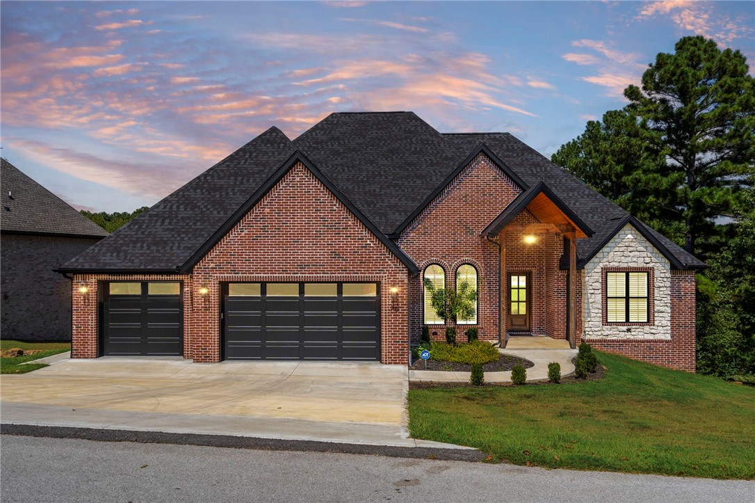 Elevated living in a place that feels like a getaway—welcome to 20 Kelaen Drive. Backing directly onto Scotsdale Golf Course with a peaceful seasonal view, this beautifully built home offers 2,802 sq ft of light-filled space on a generous 0.66-acre lot. Inside, soaring ceilings and spacious rooms create an airy, open feel, while wide-plank European oak floors & two-sided gas fireplace add warmth and character. Every detail works in harmony—from Latham cabinetry, quartz surfaces to custom trim, a spa-like primary suite with marble walk-in shower, & soaking tub. Oversized Windsor windows frame the natural surroundings, & covered deck invites slow mornings & relaxed evenings. Guest bedrooms share a Jack & Jill bath, & powder room adds convenience. A 3-car garage & whole-home generator offer comfort & peace of mind. Golf, trails, & Bella Vista amenities just minutes away. This home designed to be lived in & loved.