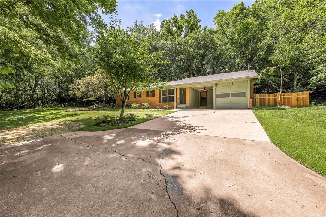 Tucked into a quiet neighborhood just minutes from downtown, a property like this one is a rare find. A third of an acre that feels like your own private retreat. Surrounded by mature trees, it offers so much shade, but there is a great lawn and plenty of sunlight for yard and garden. The extra long driveway off Jackson Dr gives it even more of a secluded, tucked-away vibe, and a seasonal stream adds a little magic during the wetter months, creating a soft, soothing backdrop when youāre sitting out by the fire pit. Now all we need a house befitting a lot like this. Oh look! Is that a completely remodeled, cute as it gets home up there? The list of updates is two pages long and it is packed with big ticket items. New roof, windows, flooring, remodeled kitchen and bathrooms, water heater, retaining wall, electrical wiring, all replaced ... You get the picture. The home has a very high-end feel, the lot is a dream, and the location is darn near perfect. I promise you, this one will not last long.