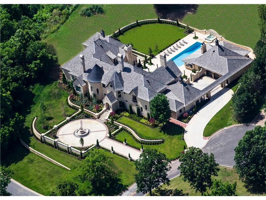 Truly a piece of France in Pinnacle Country Club, this palatial limestone estate blends delicate French grandeur w/21st-centry amenities. Some architectural elements include Amish beams, Tibetan temple hardwood floors, custom made French crystal chandeliers & Chateau cabinetry.  Property features 6 en suite bedrooms, elevator, grand reception rooms, theatre room, his/her private master bathrooms, wellness room, wine cellar, safe room, library & impeccable gardens w/a resort-style pool & pool house.