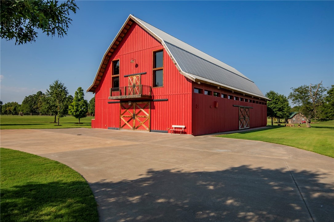 Stunning 16 acres located at the corner of Rupple Road and Weir Road. Well maintained and manicured property accompanied with three buildings: two used for special events and one for maintenance. The 9,567 sqft custom designed barn has space for 200 people and comes complete with a commercial-grade kitchen, large storage room, two restrooms, upstairs office, and all FF&E including a projector and retractable screen. The smaller 576 sqft building has living quarters and overlooks a 2-acre lake. The 3,000 sqft maintenance building off Weir Road has plenty of room for equipment, additional storage, and includes a large overhead door. A beautiful lake and large trees make this unique property desirable for living or working. The property is fenced and gated with two separate entrances: one off Rupple and one off Weir Road. Water, electric and gas are on-site and city sewer will be installed on Weir Road.