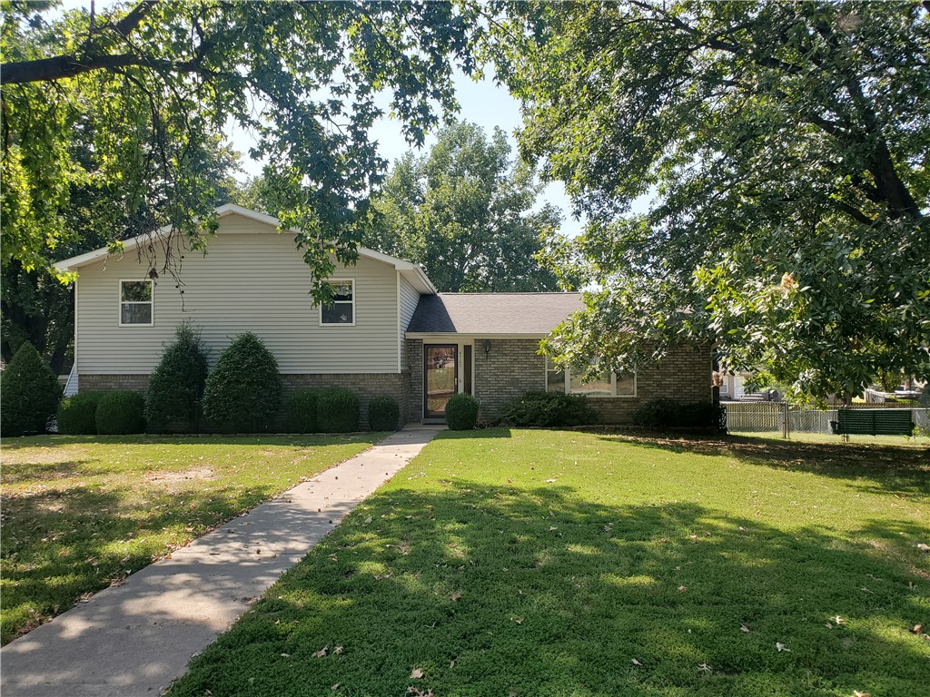 This one-owner home is now ready for its new occupants. It boasts a spacious living room complete with a wood-burning fireplace and hardwood floors. The kitchen features a built-in china cabinet, a desk, and ample cabinetry. This tri-level home offers abundant storage space on the lower level. Additionally, there is a detached workshop. The half-acre yard is beautifully landscaped with mature trees providing plenty of shade.