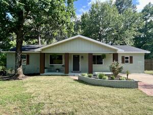 COMPLETELY RENOVATED home in Atkins! Step into your newly renovated home featuring a split 4 bedroom, 2 bath layout with an open floorplan and fully fenced in backyard. Completely renovated in 2023, this home features a new roof, HVAC system, and tankless water heater. Inside you'll be delighted by the welcoming color palette displayed through fresh wall colors, warm tone LVP flooring, beautiful granite and modern tile in the bathrooms. Large windows throughout give an abundance of natural light bringing the outdoors in. The exterior of the home has been completely painted and the large backyard boasts a new back deck perfect for entertaining! There's even a pad for parking your RV or large trailer. The list goes on and on!! Call today to schedule the showing of your new home!
