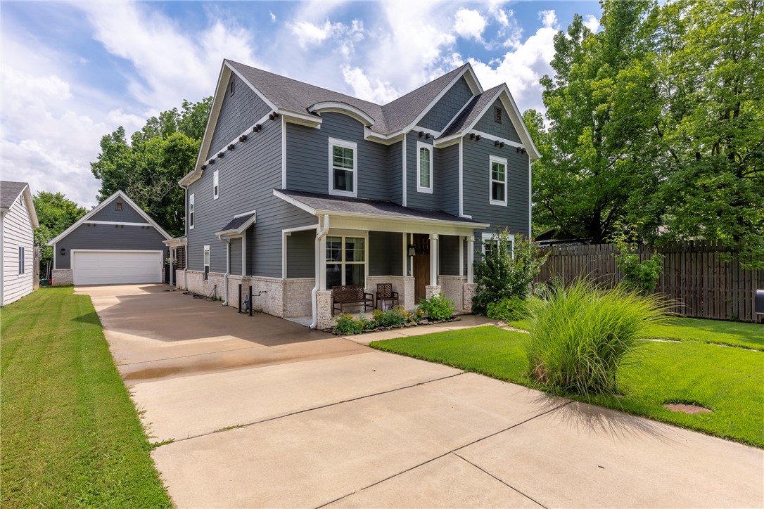 Discover this hard-to-find newer built 4-bedroom, 3.5-bath residence nestled in Fayetteville's charming historic district! The home boasts wood floors, elegant granite countertops, custom cabinetry, an inviting open layout, and a convenient mudroom. The bright living area floods with natural sunlight, showcasing custom built-ins and a cozy gas fireplace, seamlessly flowing into a sleek, contemporary kitchen equipped with premium stainless-steel appliances, a charming farmhouse sink, and a dedicated wine fridge. The primary suite offers generous space and a luxurious attached bath featuring dual vanities, distinctive tiling, a relaxing soaking tub, and a separate walk-in shower. Head upstairs to discover ample living options, including a versatile bonus space, a guest bedroom with its own private bath, and two additional bedrooms sharing a bathroom. Step outside to an expansive covered patio with a fireplace, ideal for outdoor gatherings. Enjoy location and convenienceāstroll to Dickson or the square.