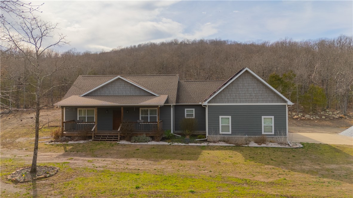 Check out this beautiful 3 or 4 bedroom with the option of a fifth sleeping area if needed. Situated on 10.44 mostly wooded acres and featuring a 38'x54' shop with 14' overhead doors. Shop is partially plumbed for an office or studio apartment. The home has a covered front porch and back deck to enjoy your mornings and evenings, and a long list of amenities! Just minutes from Walmart and downtown Harrison, the Hub of the Ozarks. Close to multiple fishing, hunting, camping, hiking, and sightseeing venues. Only 45 minutes to Branson MO, Table Rock, Taneycomo, and Bull Shoals Lakes, the White River, and within 20 minutes of the Buffalo National River. A great place to call home and enjoy the Ozarks!