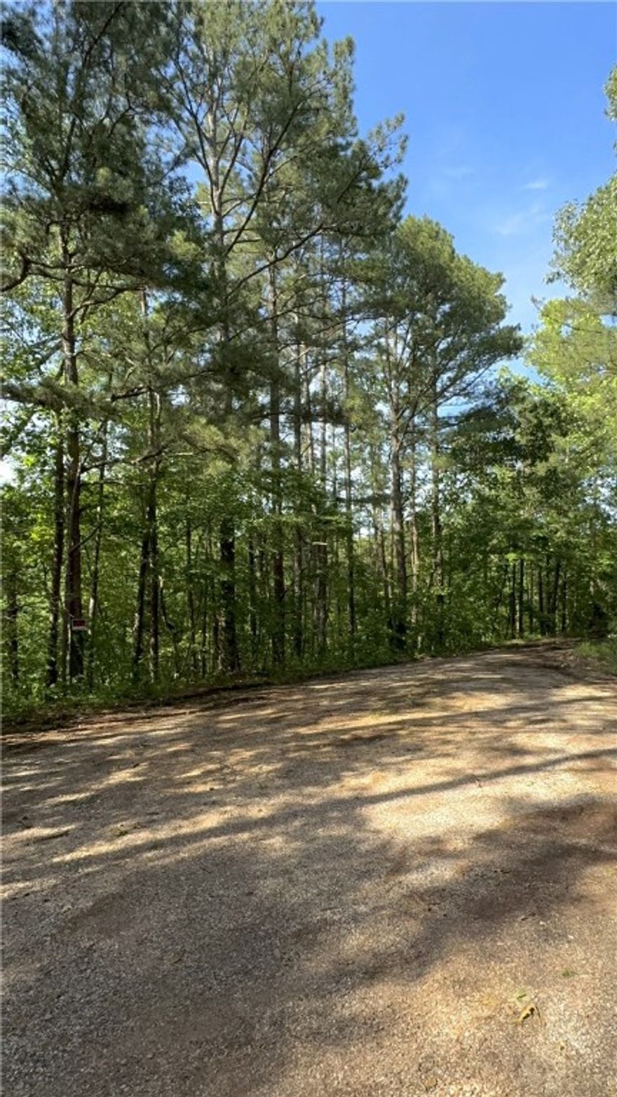 Already perced 1-acre with awesome building potential. These two lots have already been combined and the land has been used for hunting, so it's walkable! Rolling and sloped, but not an unusable pitch. It's at the end of a cul-de-sac, where the road entering the neighborhood is paved, and then turns to gravel/dirt. It was a city-maintained lot that was parceled out in 2017. Prime biking location. There are existing homes spaced out on the street, with more new builds going in. The perfect blend of neighborhood and privacy, joined together in nature. We are back on market at no fault of the seller.