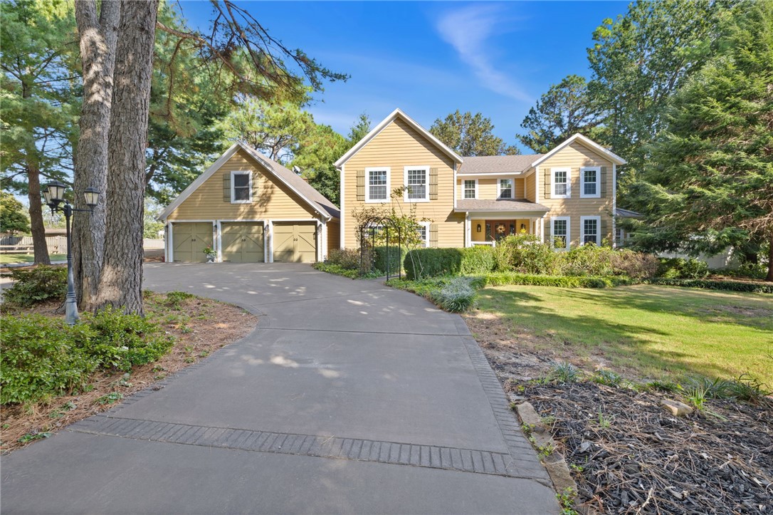 This updated estate is a rare combination of luxury, privacy and location. The property features a 3,447 SF home, separate studio apartment and 30'x30' shop building on 1.77 acres. The main house has three upstairs bedroom suites, each with an ensuite bath. Primary suite is spacious with vaulted ceilings, enormous closets, private balcony. The 1st floor includes a chef's kitchen, formal and relaxed living areas and a 1/2 bath. Kitchen has Wolf appliances, custom cabinetry, farmhouse sink and butler's pantry. 3-car garage with a 404 SF studio apartment above with separate entrance and private deck. AirBnB potential here with a great location in NWA. Excellent privacy on large fenced property in an amazing location. Gated side St access to 30ā x 30ā insulated metal shop with two overhead doors (12' and 8'), power, EV charging hookup, concrete floor, metal roof. 15' to center beam. 10' side walls. House is on septic, there is sewer access on site. Conveniently located near I-49, schools, shopping & dining.