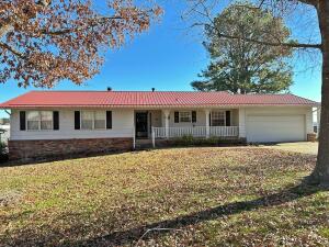 Well maintained 4 bedroom, 2 1/2 bath home with newer metal roof, updated kitchen, gas log fireplace, partially finished walkout basement, 2 car garage, nice covered back deck, and chain link fenced back yard. This house has a lot of bang for the buck!