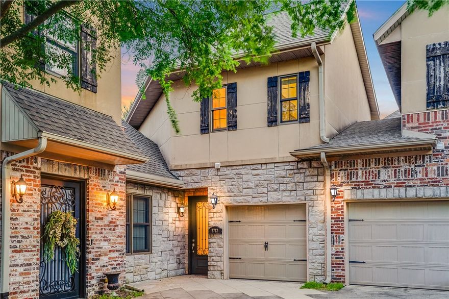 Positioned in the heart of Northwest Arkansas, this beautifully maintained condo offers exceptional access to Rogers, Lowell, Bentonville, and beyond. This two-level unit features 10-foot ceilings, crown molding, and quality finishes throughout. Upstairs, both spacious bedrooms offer ensuite bathrooms and large walk-in closets for added privacy. The open-concept main floor flows seamlessly to a private patio ideal for entertaining or quiet mornings. An attached garage provides security and extra storage. POA covers exterior maintenance, sewer, and insurance. Located only 1.4 miles from I-49, you are minutes from the Walmart Home Office (19 min), Walmart AMP (9 min), Downtown Rogers (15 min), and J.B. Hunt HQ (10 min). Enjoy nearby Pinnacle Hills shopping, business hubs, and Razorback Greenway Trails. Perfect for professionals seeking low-maintenance living or investment opportunity in a prime location.