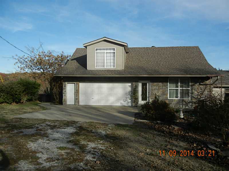 Nice area of upscale homes. Enjoy view of the fish pond from gamerm w/woodstove. Granite built in buffet. Huge covered rear porch. Kit/fam rm combo. master w/2 WIC, private balcony & sitting area. Large UT rm w/pet bath & cabinets. Related living poss.,30'x50' workshop with 220 service & separate meter. Loafing shed, hay storage. Play area, fenced for horses. Country living close to amenities.