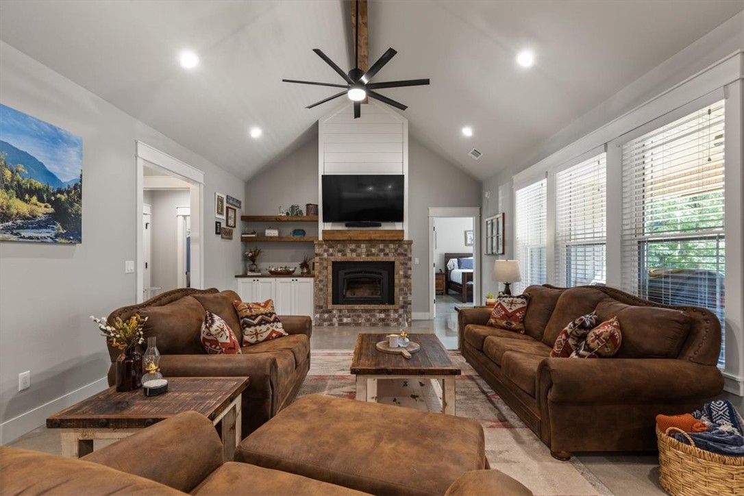 Modern 3 Bed, 2 Bath Home + Extra Lot Near Lake Ann! Built in 2022, this well-maintained home on Bella Vistaās NE side features polished concrete floors, an oversized 2-car garage with epoxy floors, and custom upgrades throughout. Enjoy watching your favorite movie with surround sound while being cozy with the wood-burning fireplace in the living room. With the leather finished granite island and propane range, host friends and family in the spacious kitchen. The primary bathroom boasts an original-antique curved claw tub, walk in shower and leather finished counter tops. Minutes to Lake Ann and easy access to Hwy 71 & Pea Ridge! Refer to parent listing for additional land for purchase, MLS # 1310071