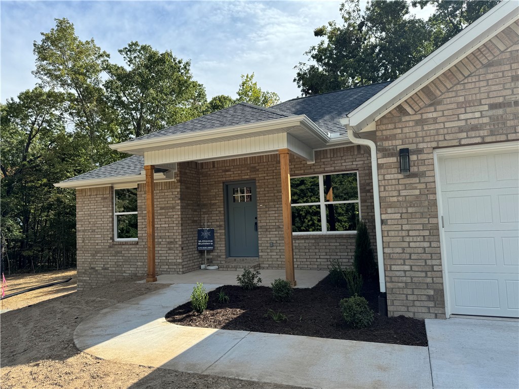 Looking for a WELL-BUILT NEW CONSTRUCTION home located on a DOUBLE FLAT LOT right around the corner from mountain BIKE trails? This is it! So many WONDERFUL things about this 3 bedroom, 2 bath BEAUTY! Split floor plan, open concept, LVP floors THRU OUT, island, pantry, gold & black finishes for a contemporary but neutral look, custom feature wall in the main bedroom, on-suite bath including a tile walk in shower, dual vanity & walk-in closet. Off the back door you can walk right out to a wooded, private, patio. The extra lot is FLAT with room for a trampoline, play set, garden or just room to play! LONG DRIVE for plenty of parking space! Lago Vista (0.2 mile entrance off Brentwood) & Uphill Both Ways are just around the corner so no need to DRIVE anywhere to hit the trails. (YES!) Lake Avalon and the BEACH is also a bike ride away! Bella Vista is BOOMING & you definitely don't miss out on this jewel. Taxes are based on the lot only and will increase once assessed with the home included.
