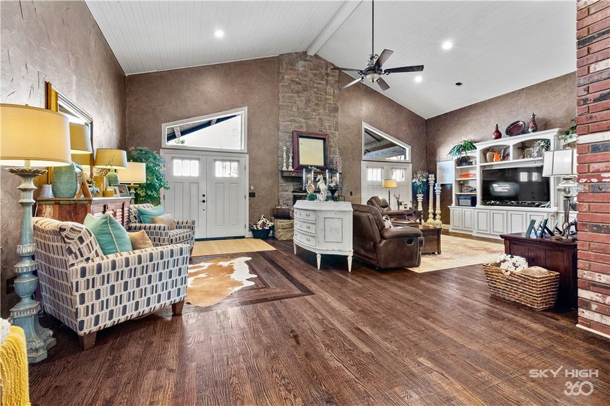 Welcome To Your Next Home! Perfection May Be Hard To Find, But This One Just May Be It! Ravishing 5000+ SqFt Updated Home Situated On 5 Level & Fenced Acres, 30x30 Shop, Large Barn/Pole Shed, Gunite Inground Salt Water Pool Surrounded By Seemingly Endless Outdoor Entertaining Space And So Much More! Step Inside And Be Greeted With By A Wide Open Living Area With High Ceilings, Beautiful Floor To Ceiling Stone Fireplace, Built-ins, And Gorgeous Hand Scraped Real Wood Floors. Those Real Wood Floors Continue Into the Chefs Kitchen Complete With Large Island, Serving Area, Built-in Appliances Including Jenn Air Gas Cooktop. Walk-in Pantry Just Off Kitchen Along With 1/2 Bath. Relax And Watch Your Favorite Show Or Team On The Big Screen In The Media Room Complete With Wet Bar. Need More? How About A Second Living Or Game Room! It's Here! HUGE Master Suite With 2 Walk-ins. The Secondary Beds Are Equally As Impressive With Attached Baths On The 2 Down And Large Bed/Bonus Up. This One Is The True Complete Package! Come See