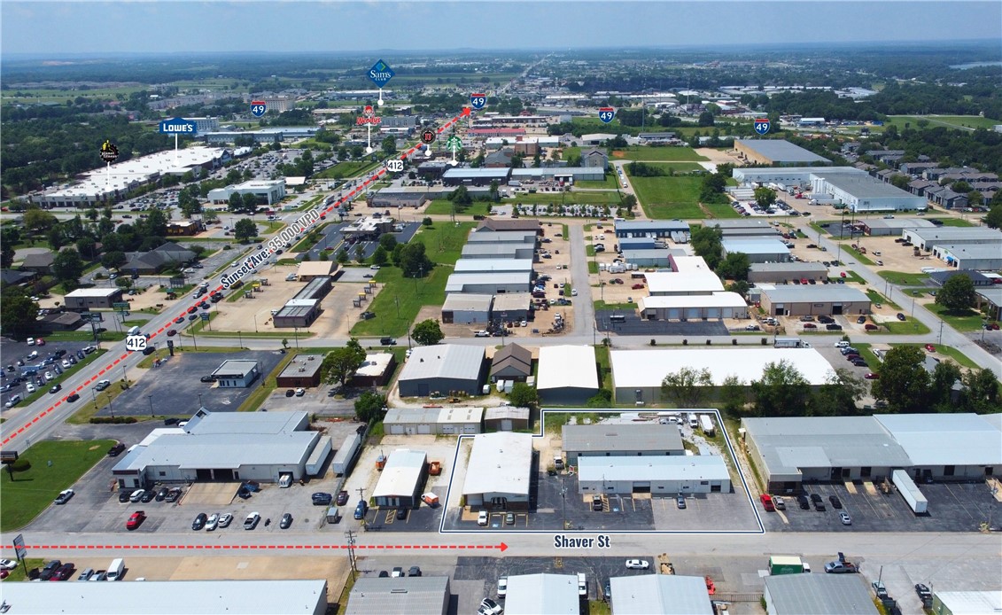 1102 ā 1104 Shaver Street is a stabilized 3-building industrial portfolio in the heart of Northwest Arkansas, totaling 14,933 square feet. The property sits less than one mile from Interstate 49 and near the Highway 412 interchangeātwo of the regionās most critical transportation corridorsāoffering strategic access for trade, service, and logistics users.
The portfolio is 100% leased across three tenants, all on triple-net (NNN) structures, generating an average in-place base rent of $11.07 per square foot and an annual net operating income (NOI) of $165,319. Based on the asking price of $1,899,000, the property offers investors an attractive 8.71% cap rate. Lease expirations are staggered between 2025 and 2028, providing both stability and future mark-to-market potential.