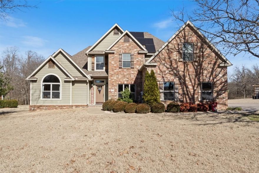 Beautiful home on 1.68 acres (mol) offering the perfect blend of space, privacy, and convenience! This thoughtfully designed 4-bedroom, 3-bath home features 2 bdrms & 2 bathrms on main level, w/ 2 addl bdrms upstairs plus a spacious bonus room—ideal for a playroom, media room, or flex space. A formal dining rm also serves perfectly as a home office. The living room showcases a cozy fireplace & stunning views overlooking the backyard & surrounding natural landscape. Located on the edge of city limits, this property offers a peaceful setting with a wet-weather creek, wooded areas for privacy, and open yard space—perfect for enjoying the outdoors. Enjoy proximity to downtown Siloam Springs, John Brown Univ, schools, businesses, & public trails just down the road. City services incl elec, water, trash, sewer. Solar panels were installed in 2019 by Shine Solar & are connected to the electric grid managed by City of Siloam Springs.This is a rare opportunity to enjoy acreage living w/ city conveniences just minutes away!