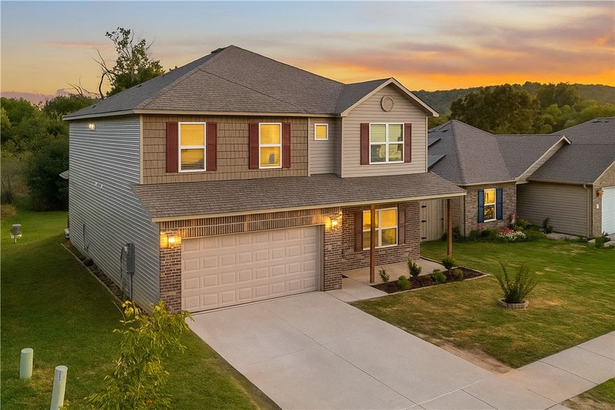 This beautiful 4-bedroom Fayetteville home offers both style and convenience. Two versatile living spaces, luxury vinyl plank flooring, and granite counters create a move-in-ready appeal. Enjoy the outdoors from the covered, south-facing patio with serene green space and sunset views. Features include 2.5 bathrooms and a 2-car garage. With unbeatable access to bike trails, parks, golf, the University, and the highway, this home is the perfect blend of function and location.